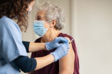 Senior receiving vaccine 