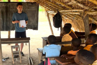 Andrew Davis presenting to students in Ghana