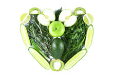 Image of green fruits and vegetables in the shape of a heart
