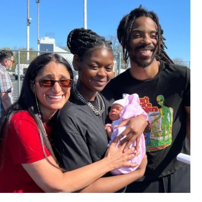 Dr. Mona and new parents with newborn in Pontiac, Michigan.